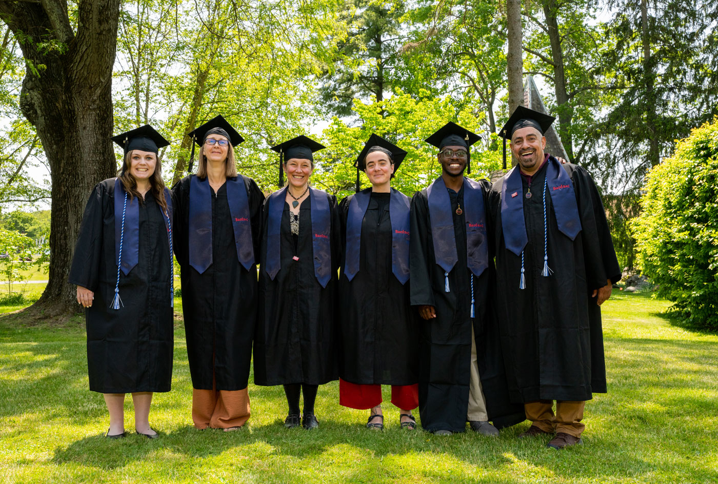 Smiling group of graduates in their robes,