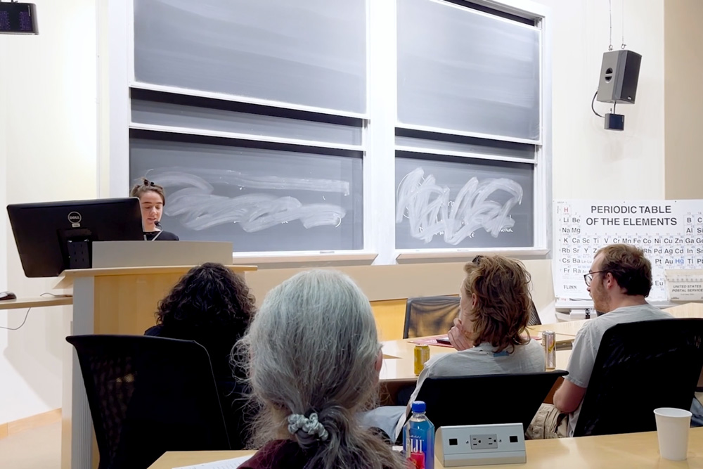 Lecture hall with periodic table.