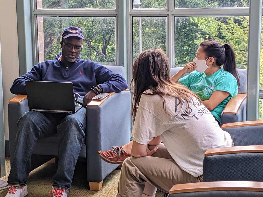 Students working together in a group indoors.